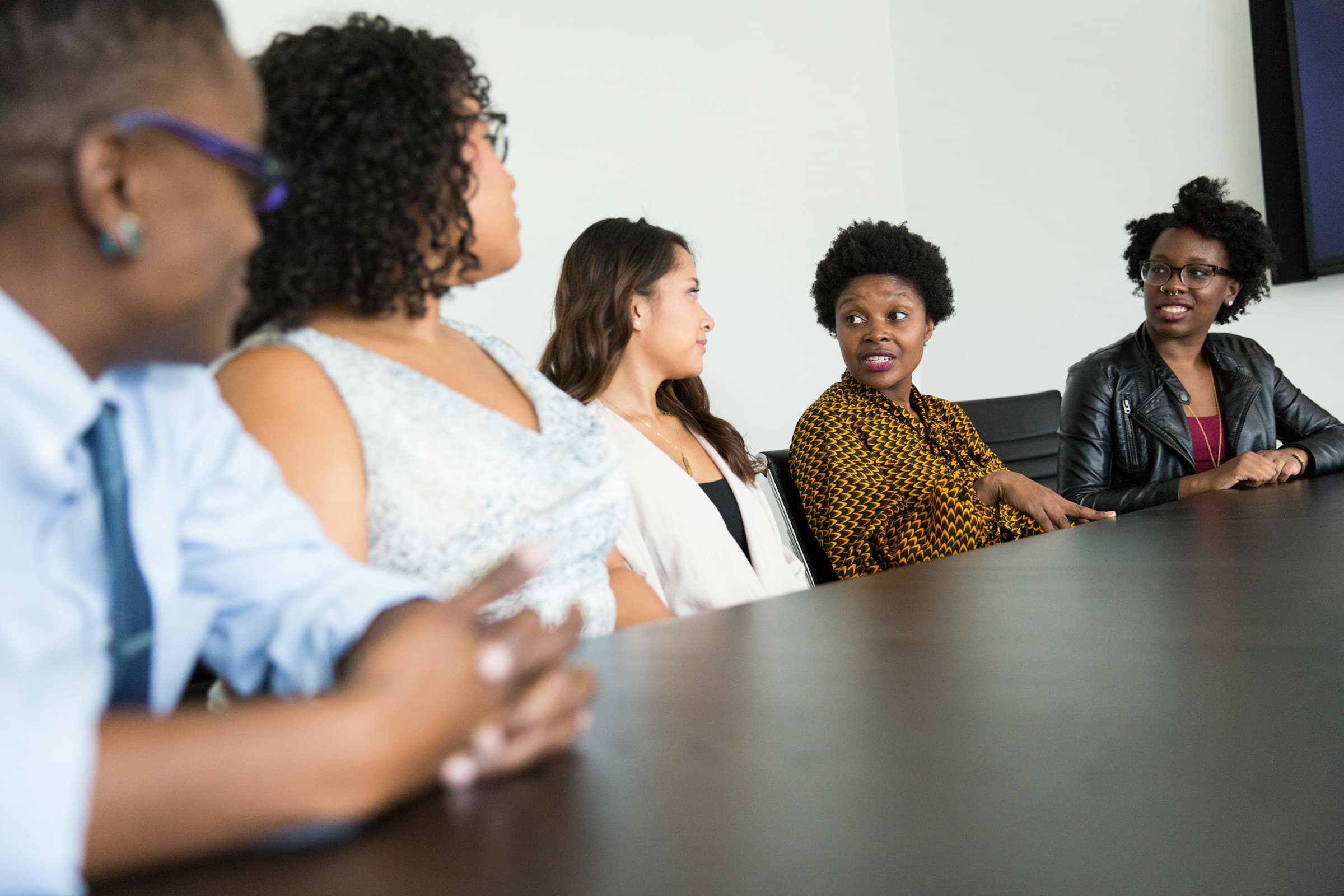 African tech professionals collaborating around a table, representing DIMTECH's AI innovation ecosystem